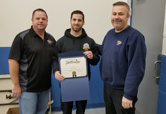 Dwayne Myers, Team Member of the Month Michael Solan, and Location Leader Paul Foster