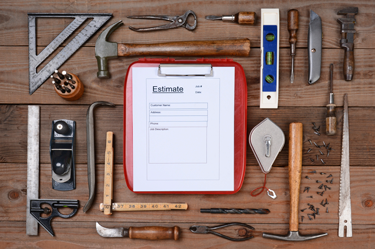 assowrtment of home improvement project tools on a workbench