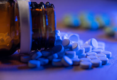 Prescription bottle of spilled pills